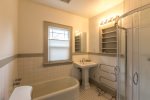 1 large bathroom with walk in shower and separate tub